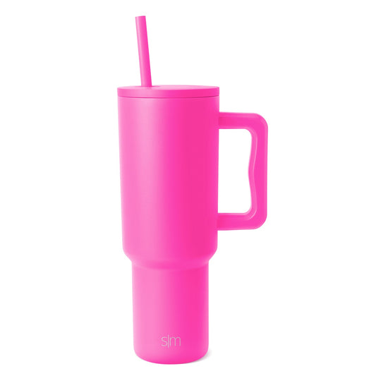 Hot pink Trek Tumbler with matching straw and handle, featuring Simple Modern logo, isolated on white background