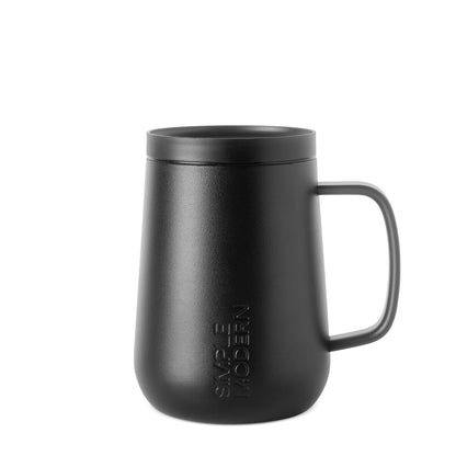 Matte black powder-coated mug with textured finish on neutral off-white background